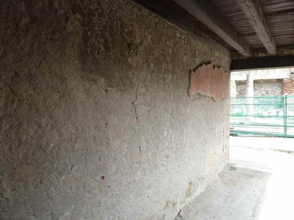 V. 20, Herculaneum, May 2010. Looking north to roadway along west wall of shop-room.